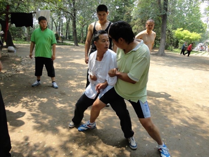 Zhou shifu, teaching Baji Quan to a group of Chinese students. All of them are bigger and heavier than him. The Chinese guy standing directly behind Zhou is Xiao Hei – a national Western-Boxing champion, who is 6'3 and weighs twice Zhou's weight.